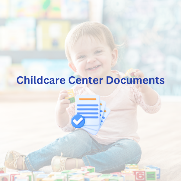 Toddler holding block and smiling at camera